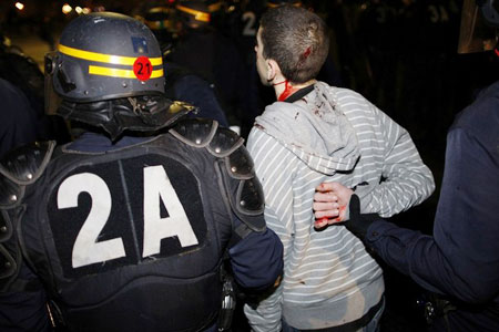 French police arrest a pro-Palestinian demonstrator after a protest in Paris against Israel's offensive on Gaza January 10, 2009. 